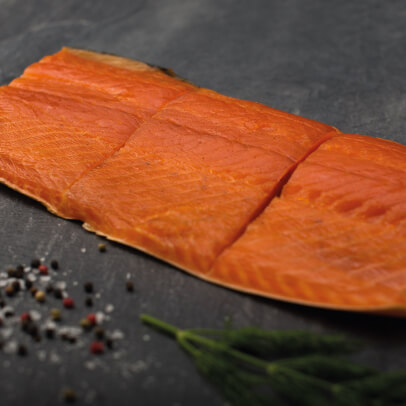 Alfred Enderby's traditional Grimsby Smoked Salmon shown with sliced thyme on a slate chopping board