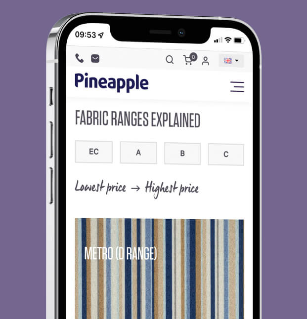 Pineapple Furniture website shown on mobile phone on a purple background
