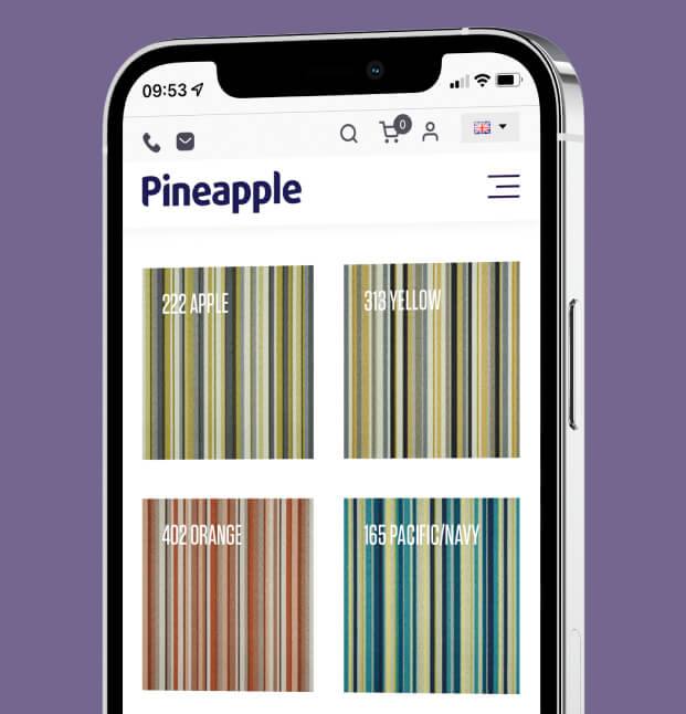 Pineapple Furniture website shown on mobile phone on a purple background