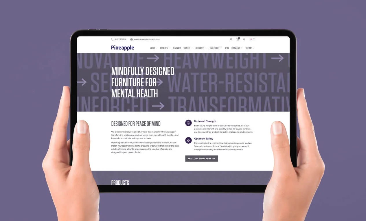 Pineapple Furniture website shown on tablet on a purple background