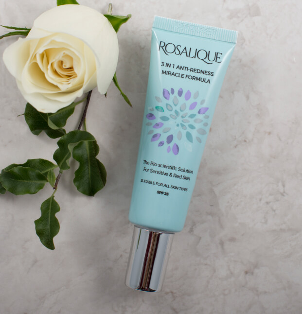 Rosalique Skincare - tube of the miracle formula cream on a marble worktop with a white rose