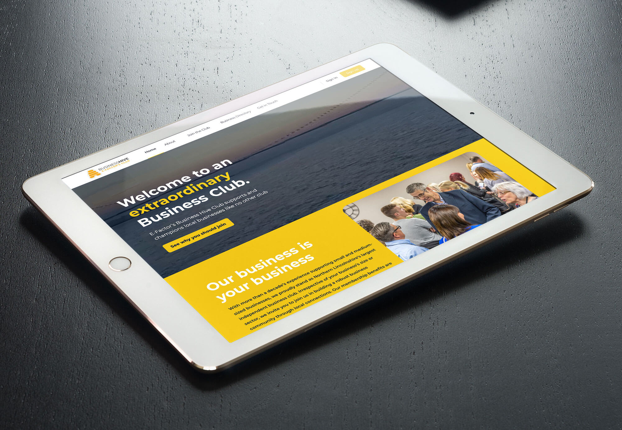 An iPad showcasing E-Factor's Business Hive, a new exclusive member hub for business clubs.